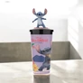 Lilo és Stitch - A csillagkutya pohár és Stitch topper, figura - Szörf - A képen a Lilo és Stitch mozifilm grafikájával díszített, a tetején egy 3D Stitch figura található